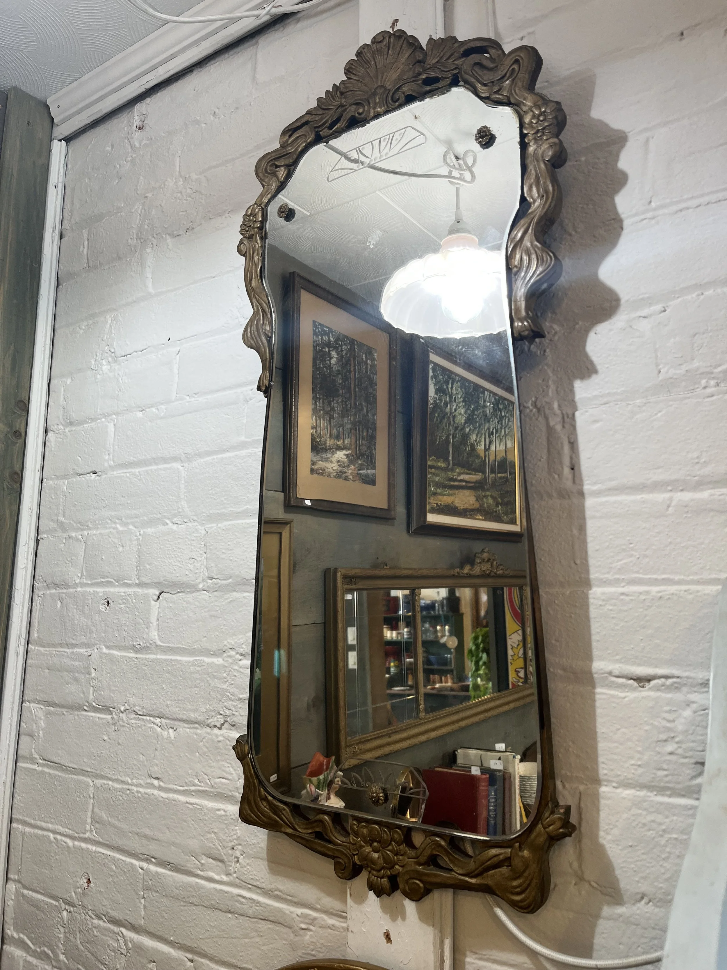 Art Deco mirror. Measures 30 " long.  ($125)