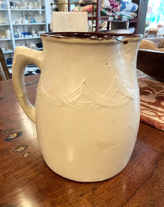 Foley Pitcher:
Excellent condition.
Fenwick D. Foley  c. 1920. Collard wrote about it is a stoneware jug (of clay from Middle Mosquodoboit, N.S.)  the design was inspired by Micmac pottery he saw in the New Brunswick Museum, and represents the waves 