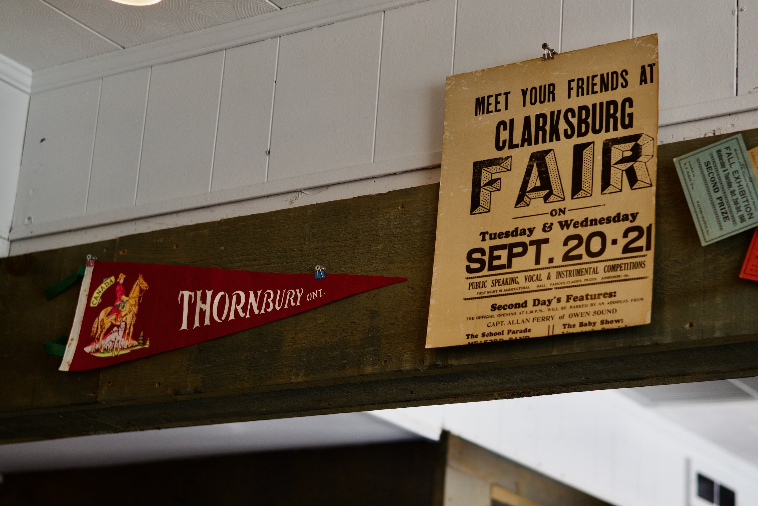A vintage poster advertising a fair at Clarkburg on Tuesday and Wednesday, September 20-21, featuring public speaking, vocal and instrumental competitions, a school parade, and a baby show.
