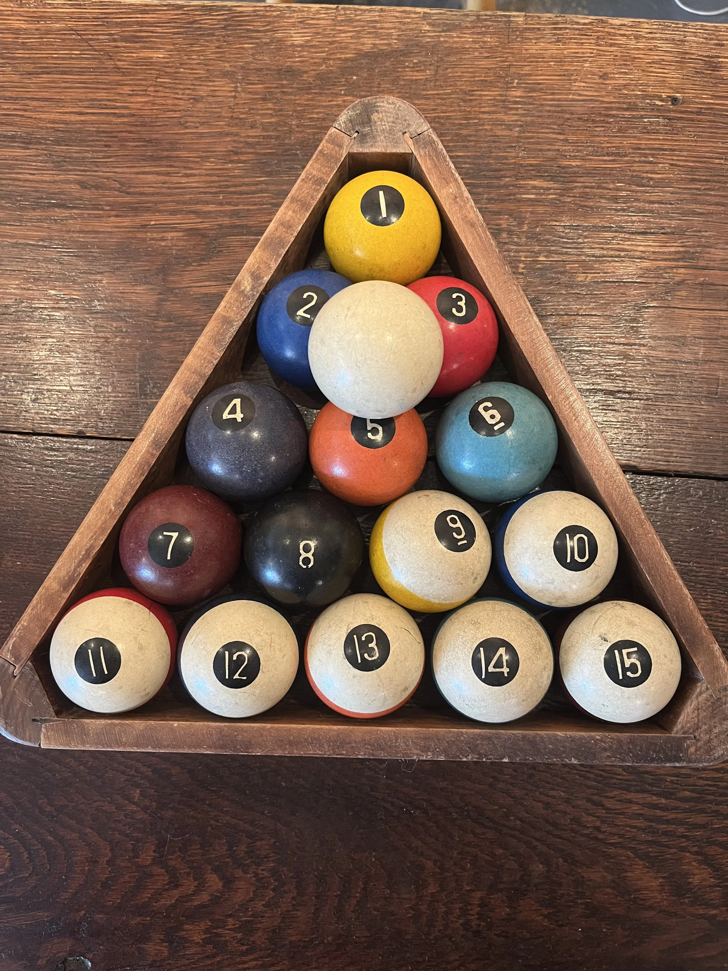 Bakelite full set of pool balls and triangle. ($85)