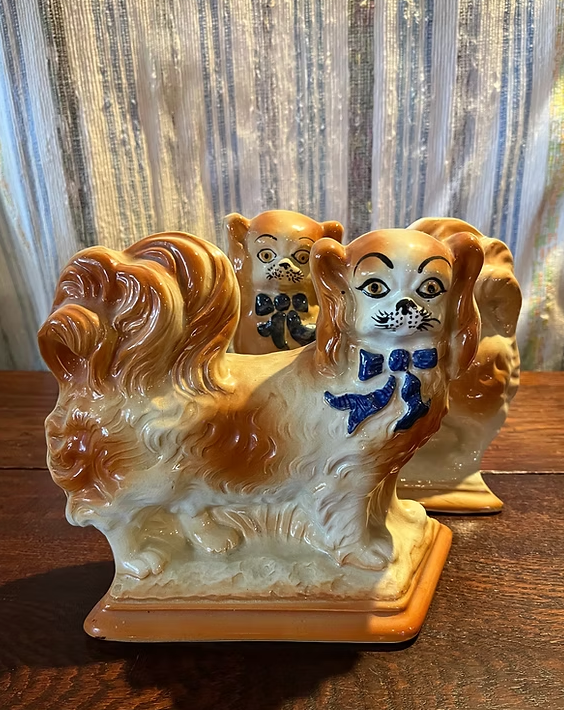 Staffordshire Dogs:
In excellent condition.
Size: measures 8" tall.
($295/pair)