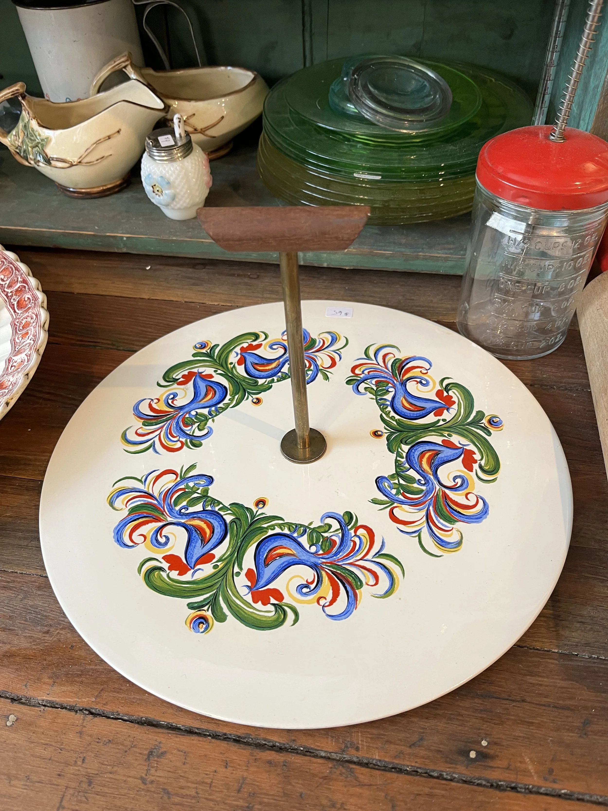 Mid Century serving tray.  Rooster design- Metal, enamel and teak handle.  Measures 12" in diameter ($65)