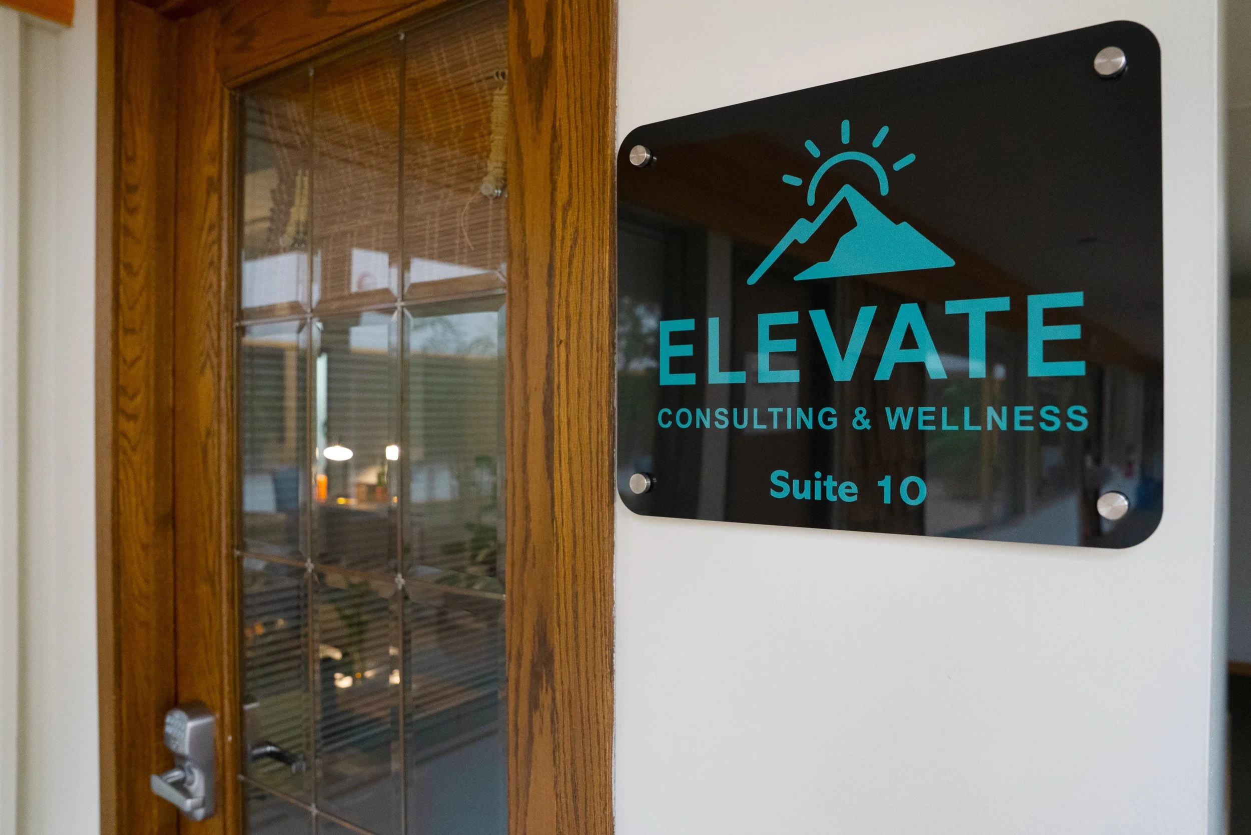 Trauma-informed therapy office in Ann Arbor designed with calming earthy tones and cozy furniture.