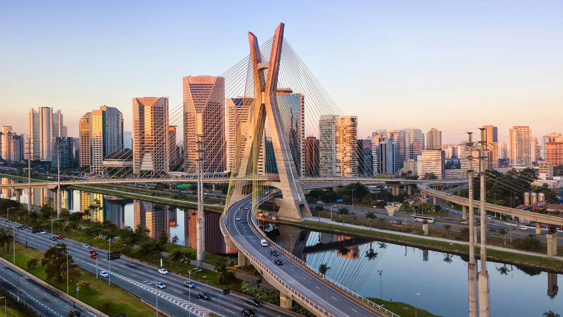 The skyline of Sao Paulo showing a bridge and several office buildings bathed in sunlight