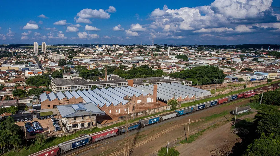 A renovated warehouse hosting a startup accelerator, front and center of a Brazillian skyline