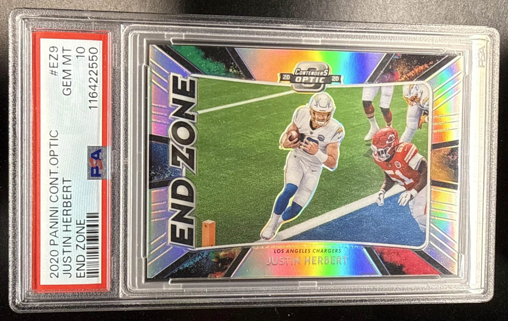 297_2020_PANINI_CONTENDERS_OPTIC_JUSTIN_HERBERT_EZ9_END_ZONE_RC_CHARGERS_PSA_10.jpg