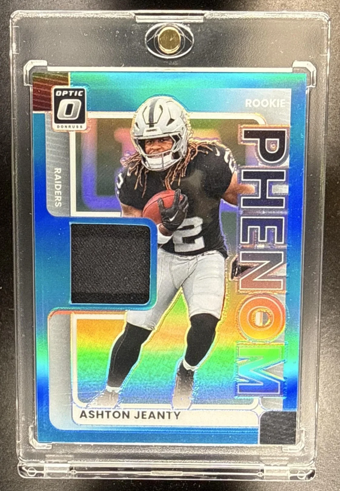 061_2025_PANINI_DONRUSS_OPTIC_ASHTON_JEANTY_RPBH_AJY_ROOKIE_BLUE_PRIZM_PATCH_RC.jpg