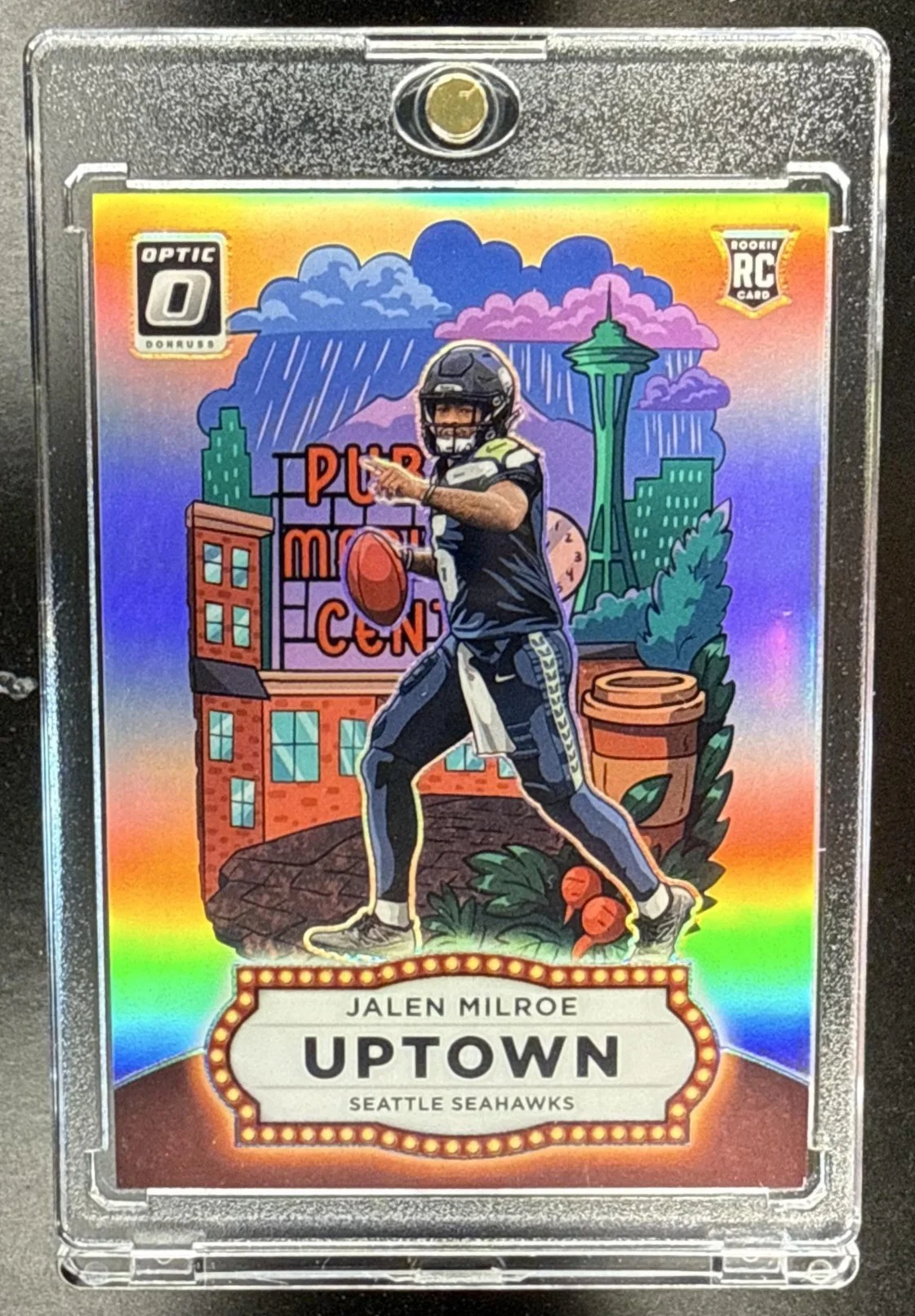 001_2025_PANINI_DONRUSS_OPTIC_JALEN_MILROE_10_UPTOWN_RC_SEAHAWKS.jpg
