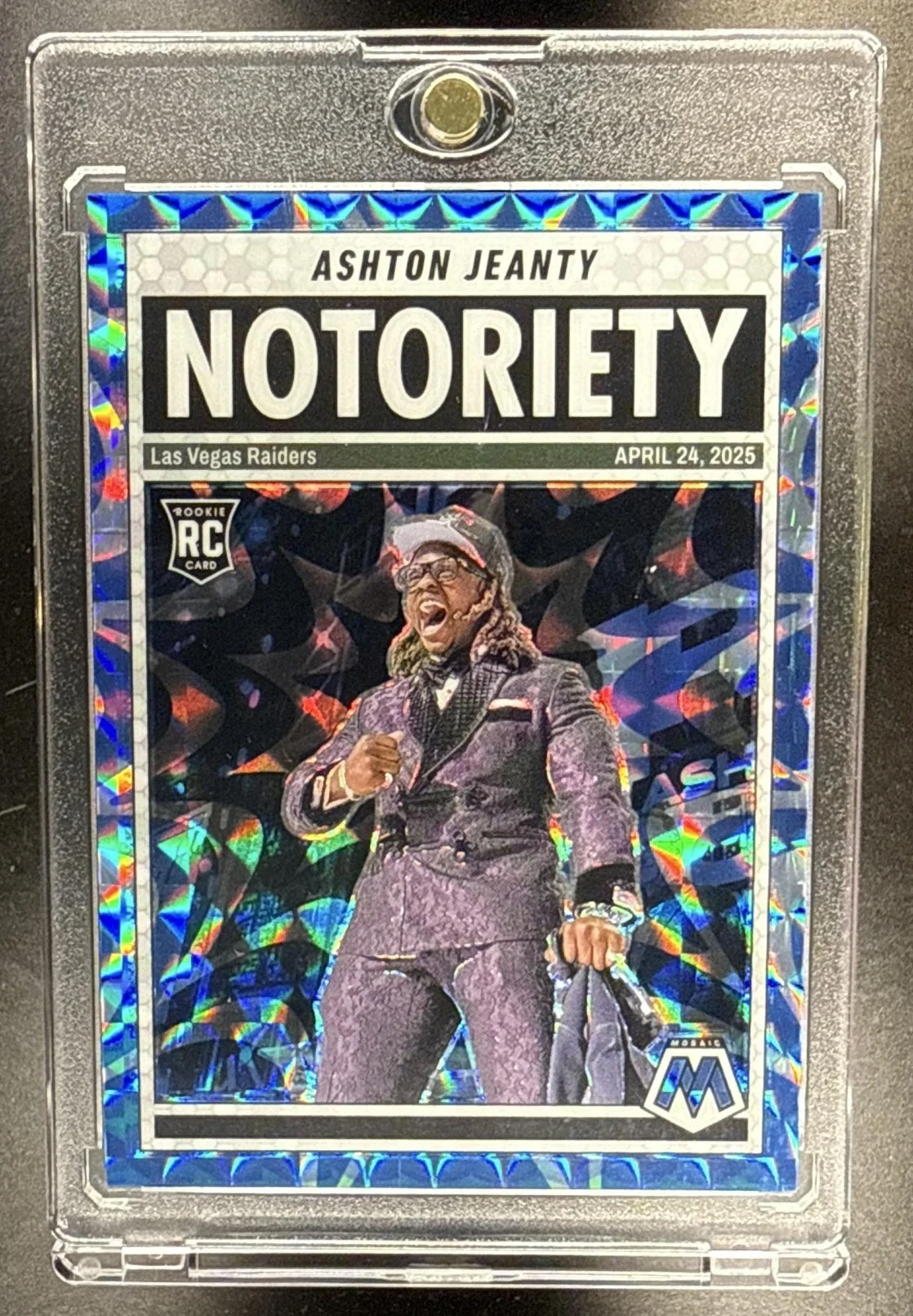 106_2025_PANINI_MOSAIC_ASHTON_JEANTY_18_MEN_OF_MASTERY_BLUE_PRIZM_33_99_RC_RAIDERS.jpg