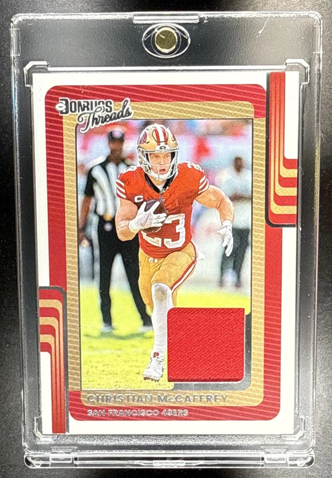 172_2025_PANINI_DONRUSS_CHRISTIAN_MCCAFFREY_DTH_CMY_THREADS_49ERS.jpg