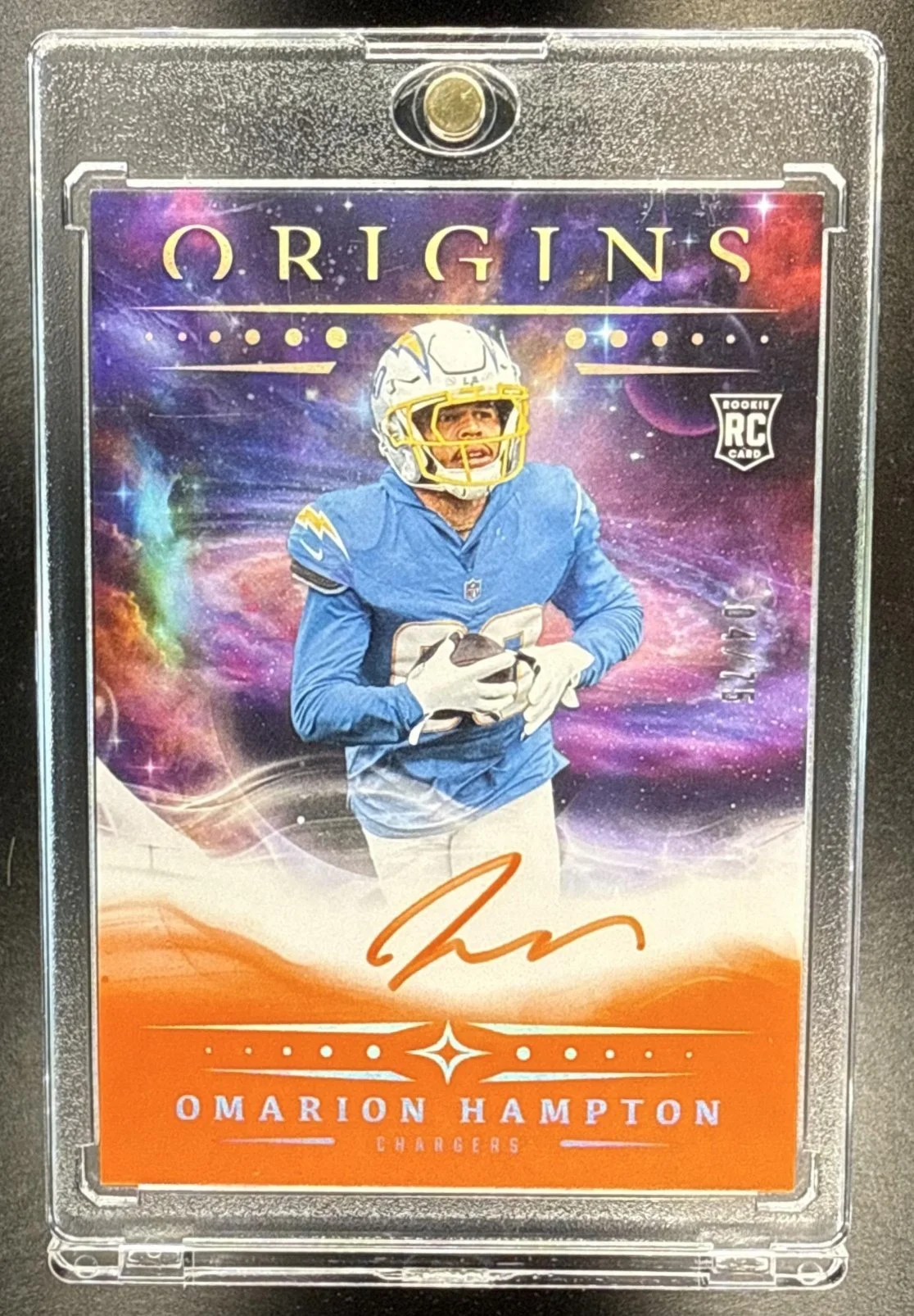 425_2025_PANINI_ORIGINS_OMARION_HAMPTON_RA_OHA_ROOKIE_AUTO_ORANGE_4_75_RC_CHARGERS.jpg