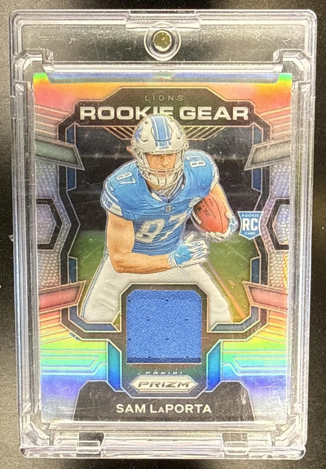 008_2023_PANINI_PRIZM_SAM_LAPORTA_RG_SL_ROOKIE_GEAR_PATCH_RC_LIONS.jpg