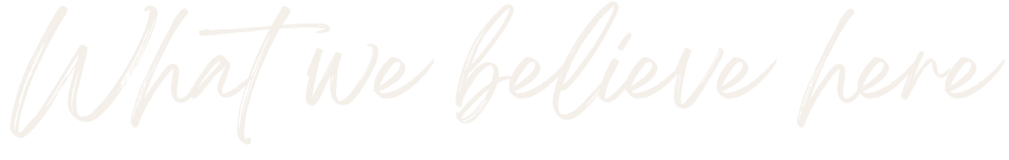 Text that reads 'What we believe here' in white handwritten font on a black background.