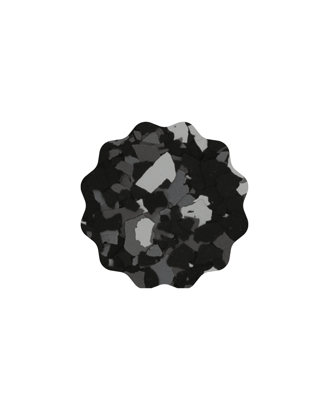 A pile of small black, gray, and white rocks or charcoal pieces.