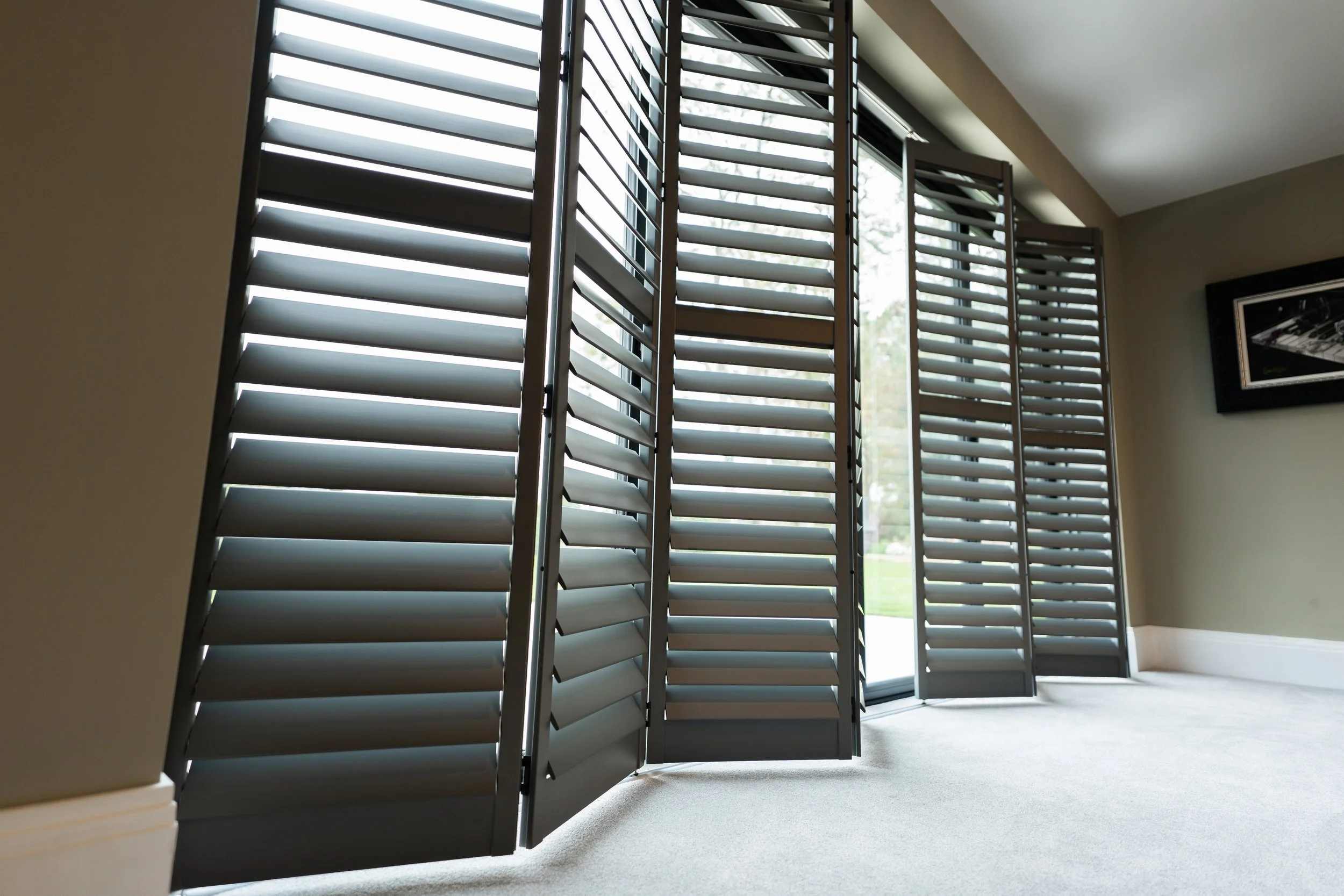 Tracked system shutter blinds.