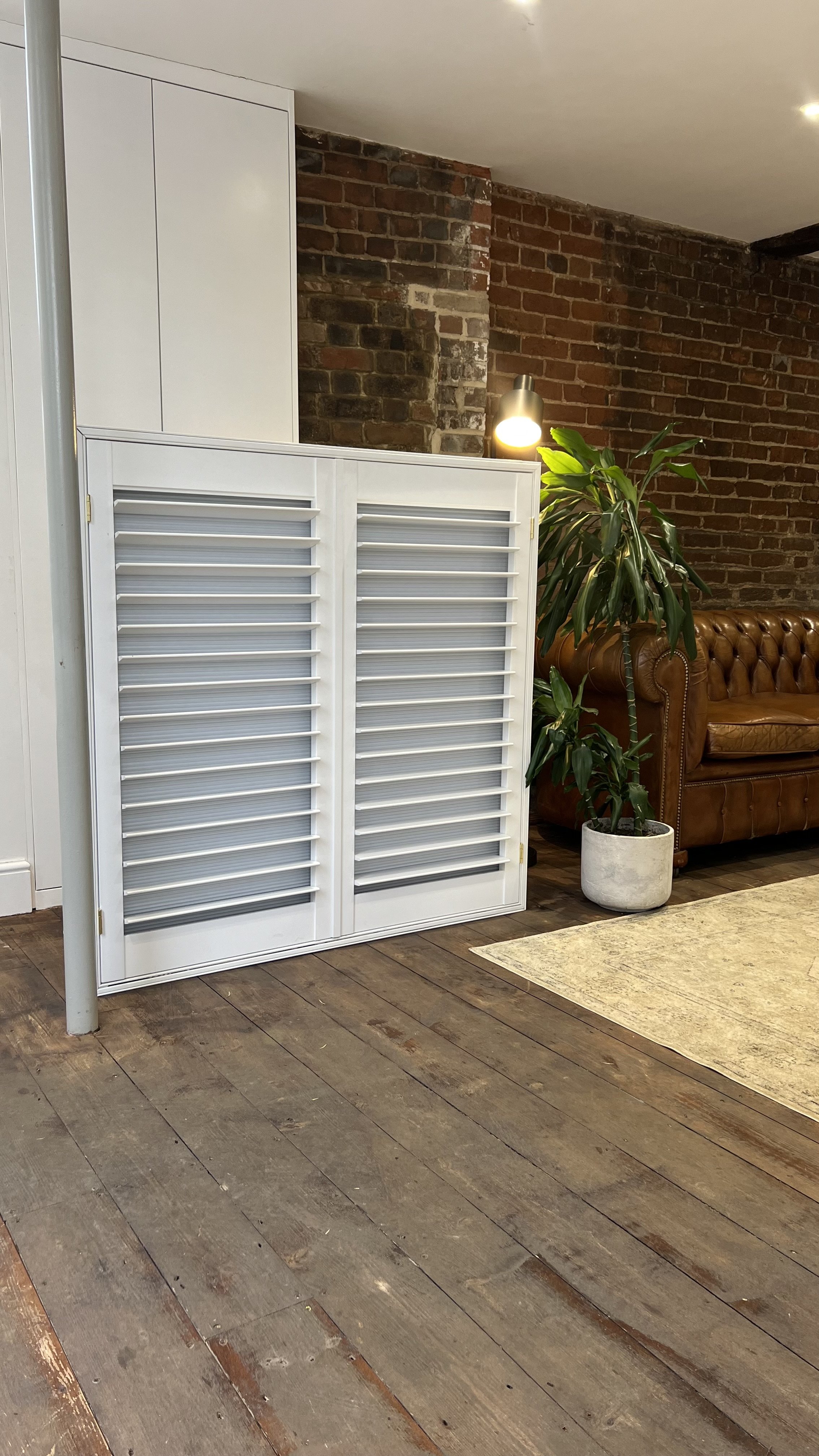 Shutters with an integrated blackout blind fully down with panels closed