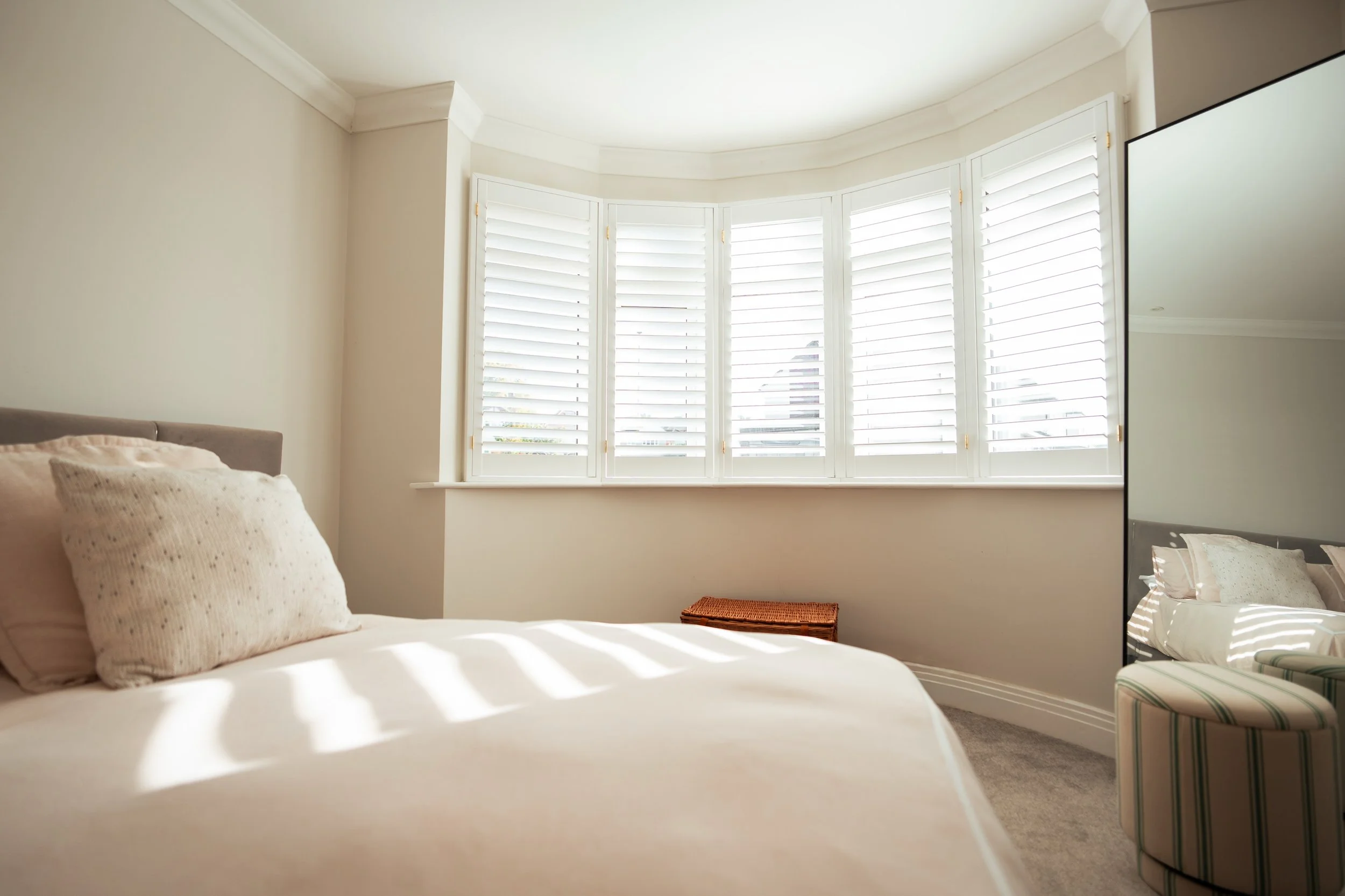 Who says you have to choose between light and privacy? Not us! 

With this bedroom at the front of the home, a solution that offered both was key. Our shutters allow full control over the natural light, while keeping the room shielded from the outsid