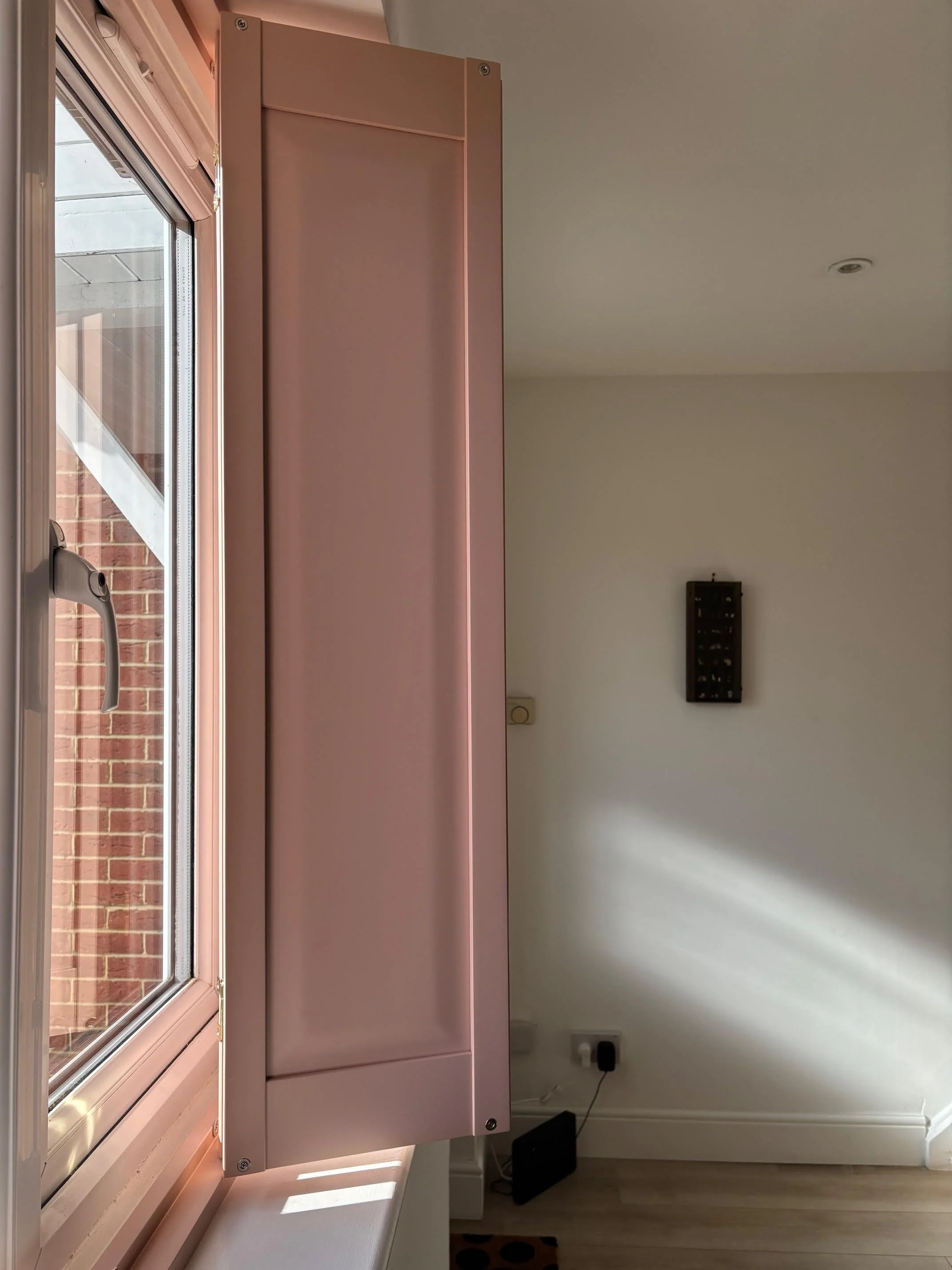 Pink solid panel shutters