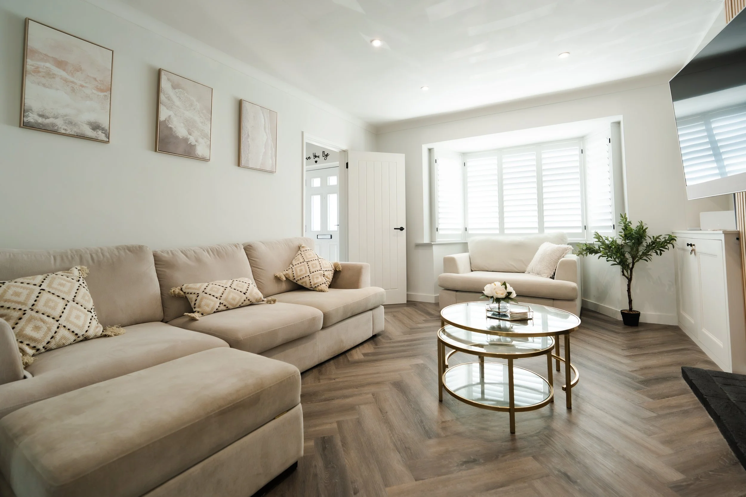 Bay window white plantation shutters