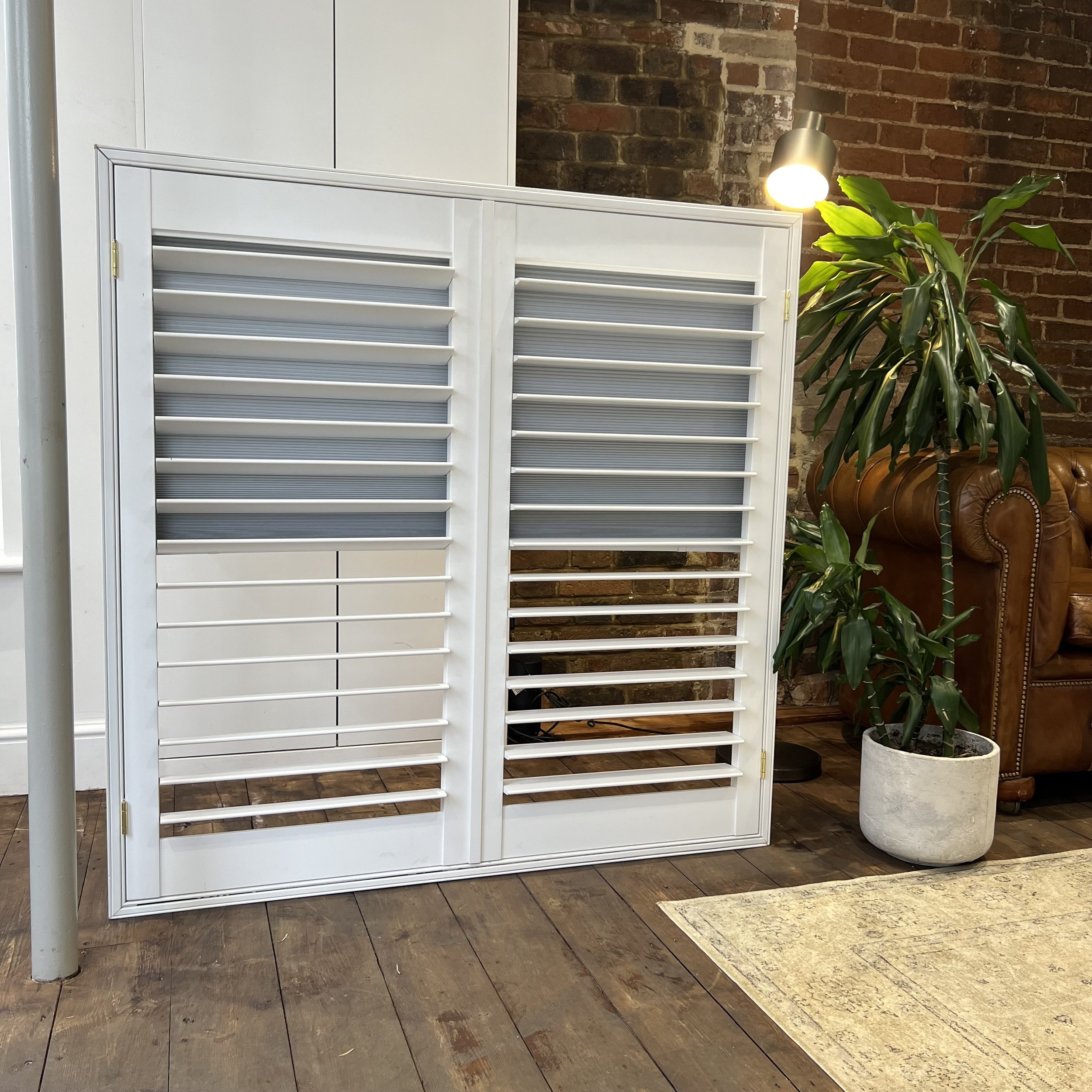 Shutters with an integrated blackout blind half down
