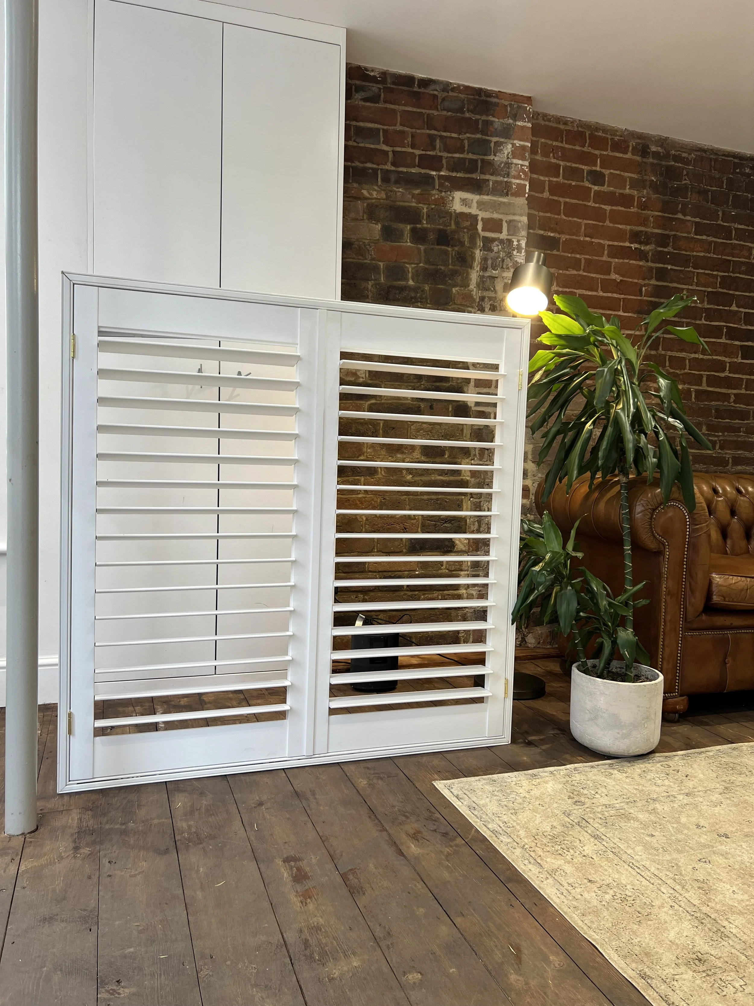 Shutters with an integrated blackout blind up