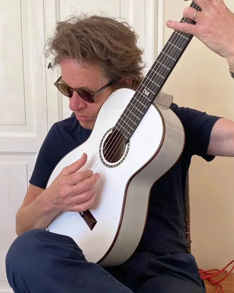 Dominic Miller is posing for the first time with Grace his unique model tribute made by K yairi