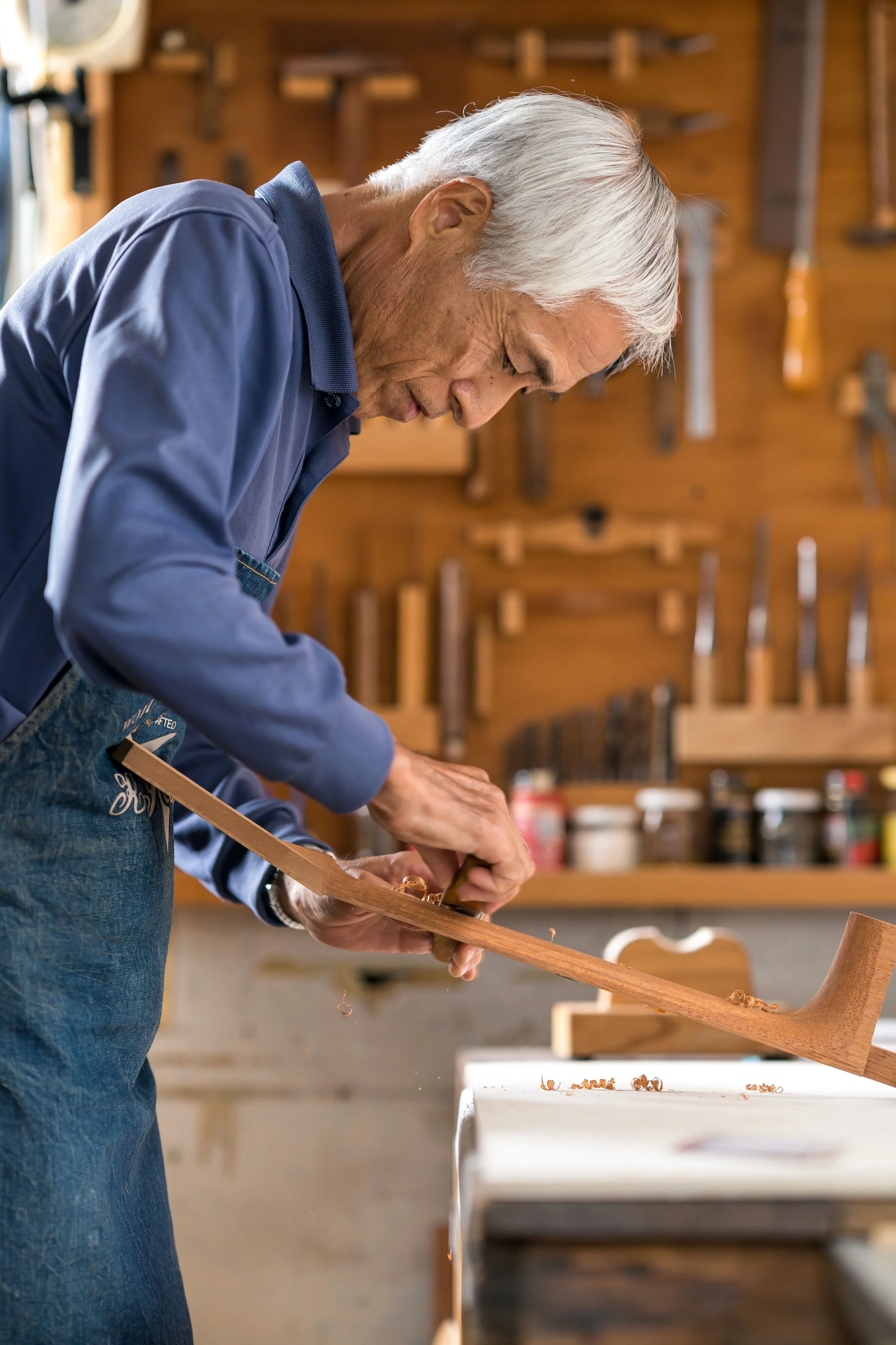 k yairi guitars manufacturer working on wood he is making a guitar