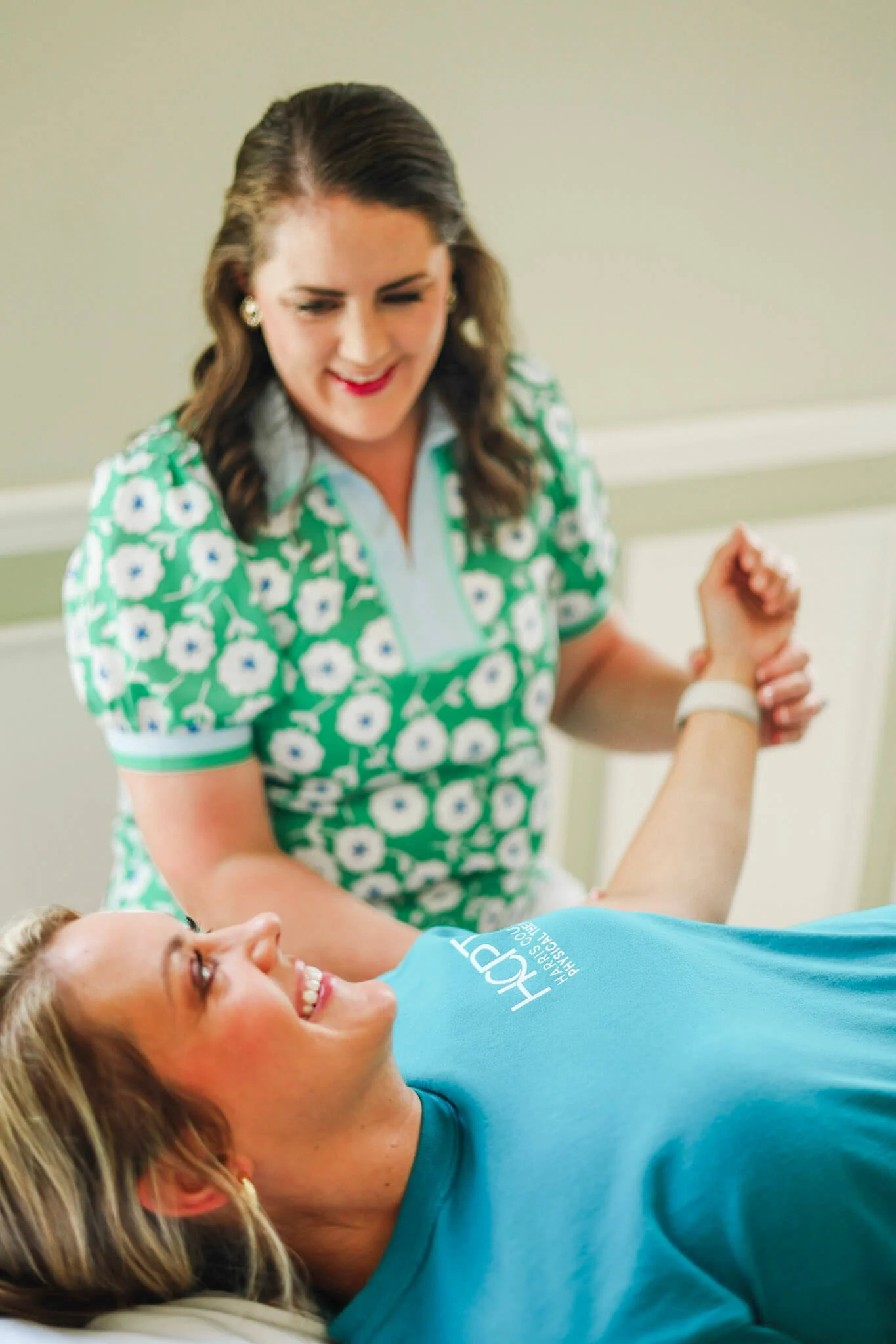 Dr. Paige Riddick working on a patient's elbow at Harris County Physical Therapy in Hamilton, GA.