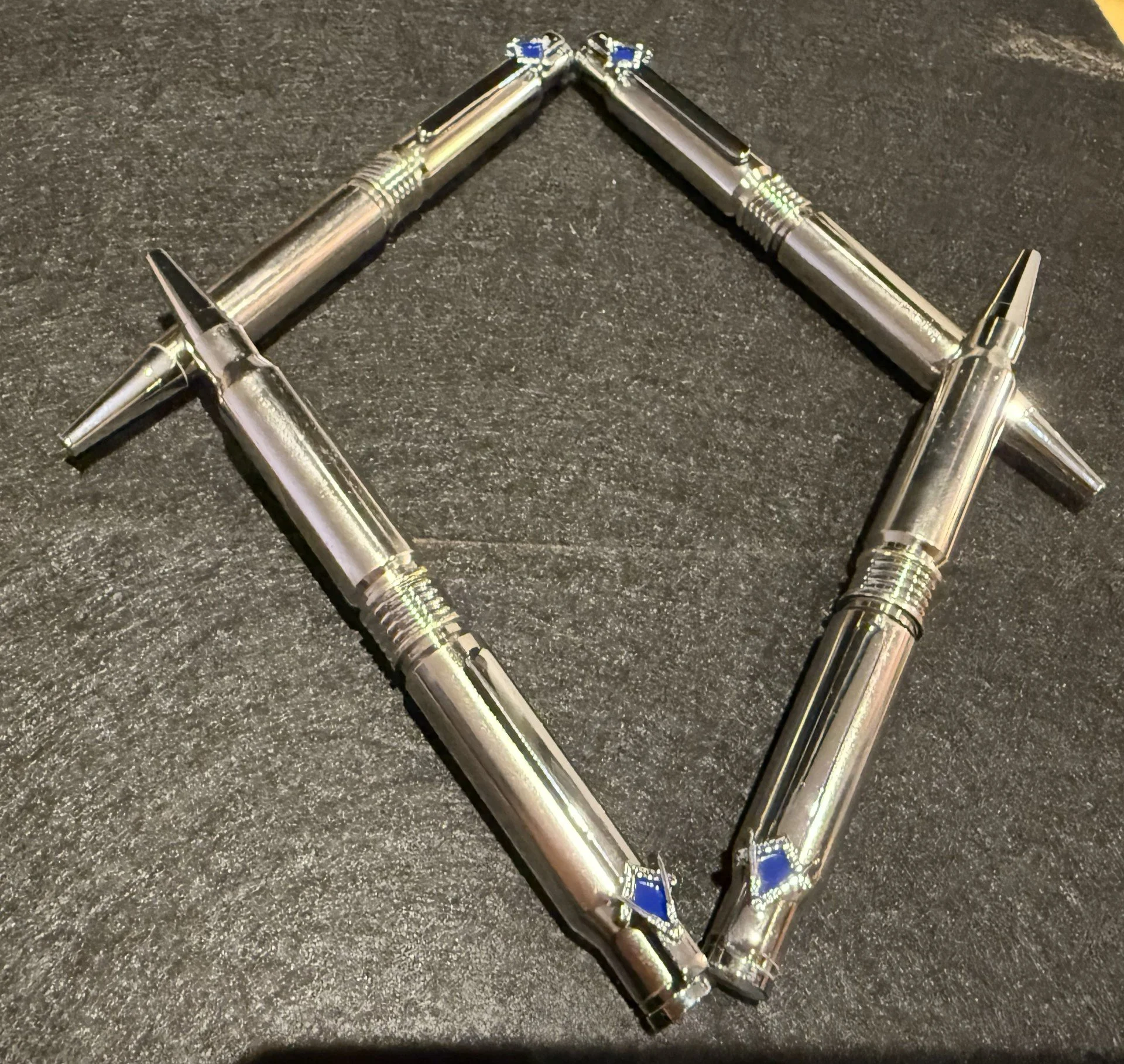 4 Masonic .308 pens.
These are made using once fired .308 casings and masonic square and compass pocket clips.  
