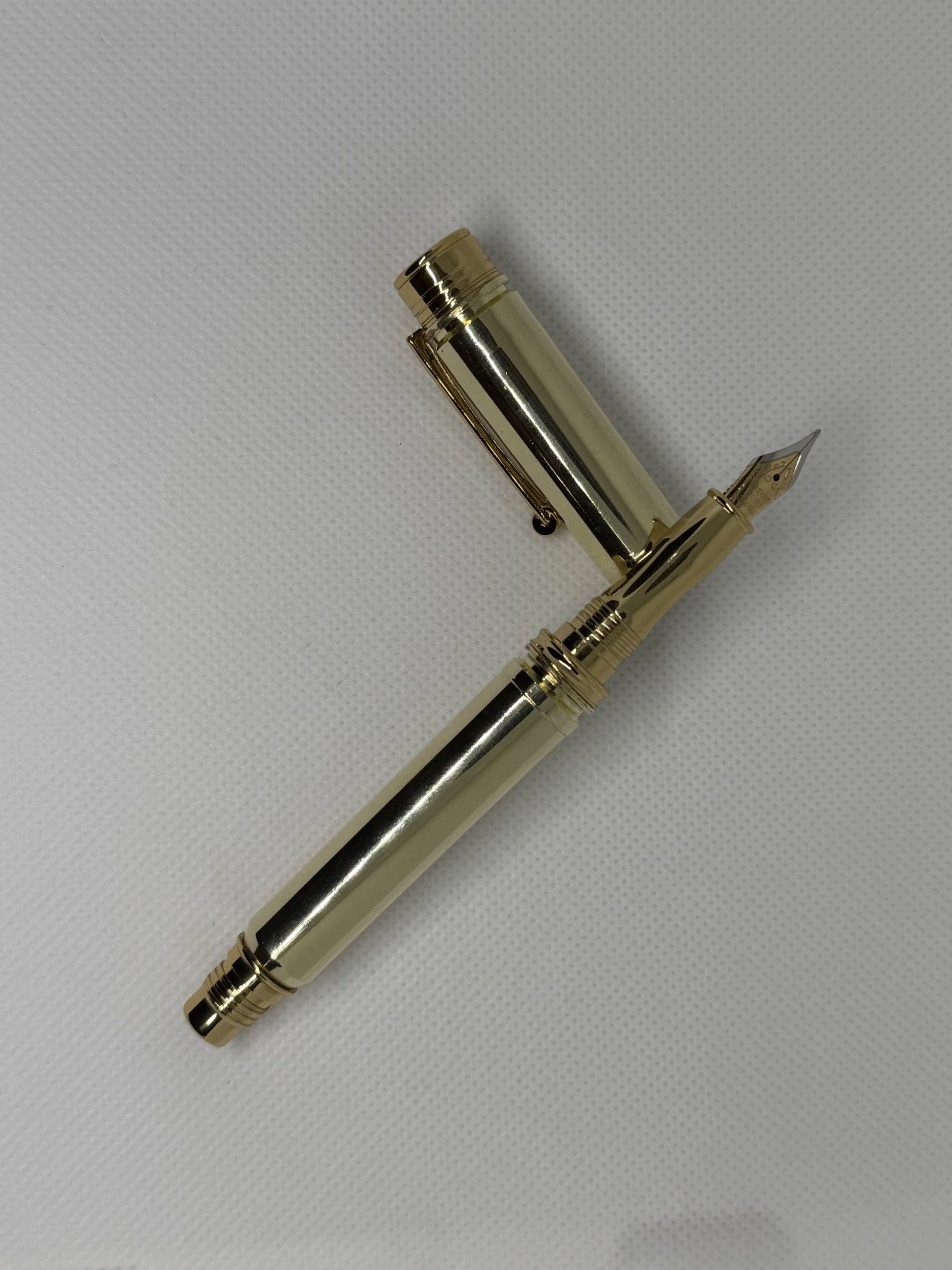 A fountain pen made with a .338 Lapua once fired casing for the lid and a .300 MEN once fired casing for the pen.