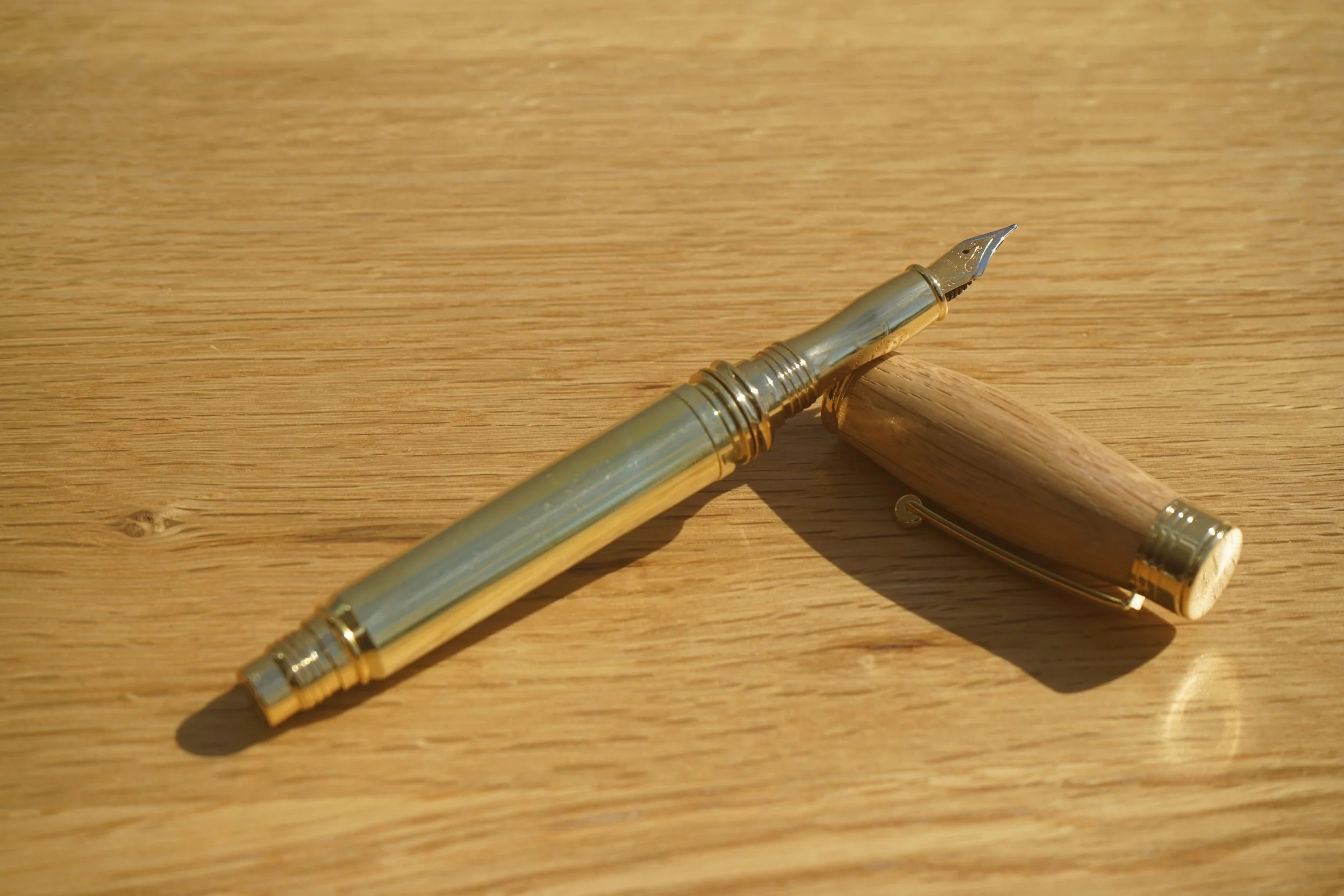 The Whisky Shot Fountain Pen.  Made with a once fired 300 MEN casing and reclaimed white oak from the Dalmore Whisky Cask.