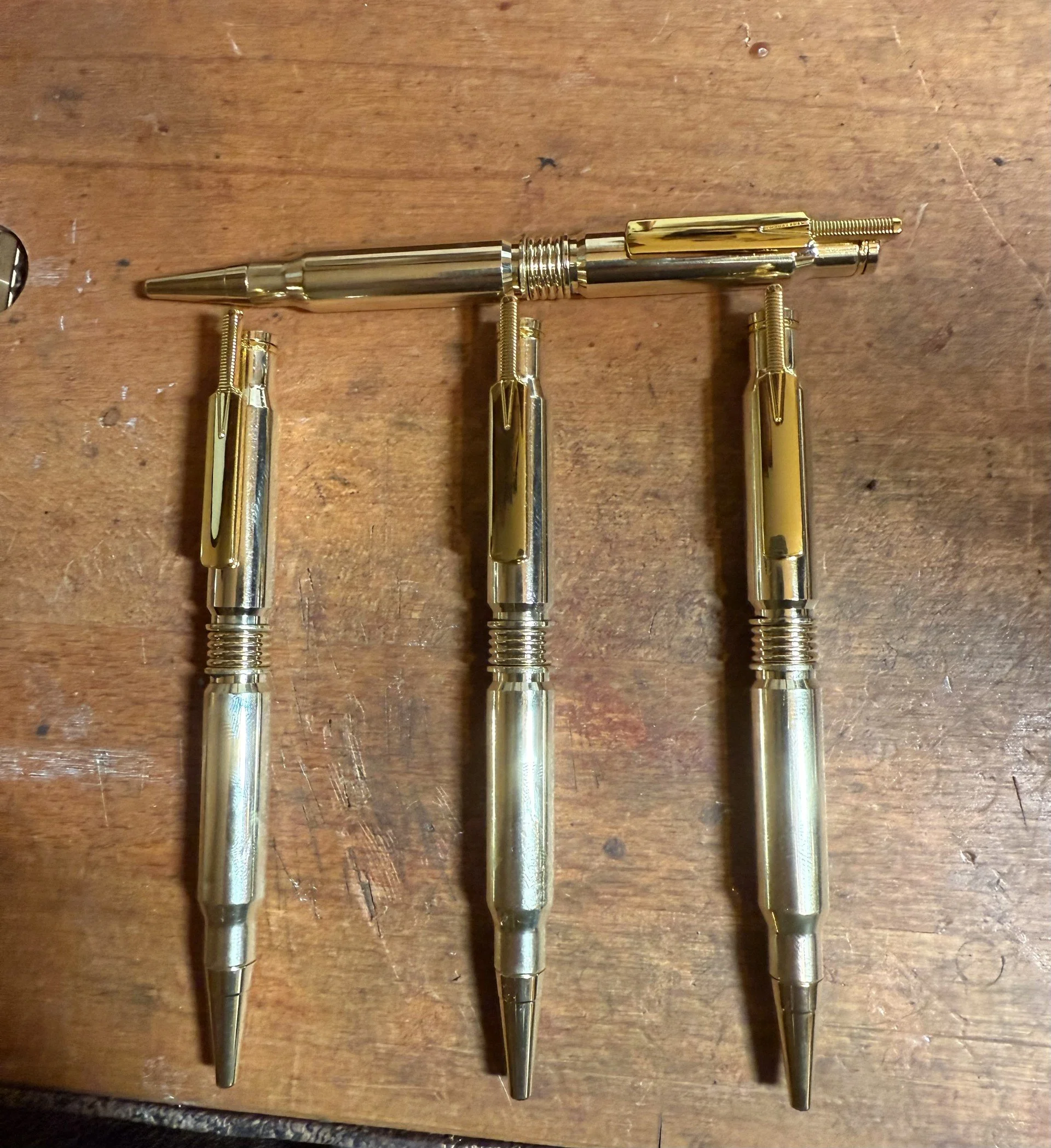 A set of .308 twist pens with cricket bat pocket clips.