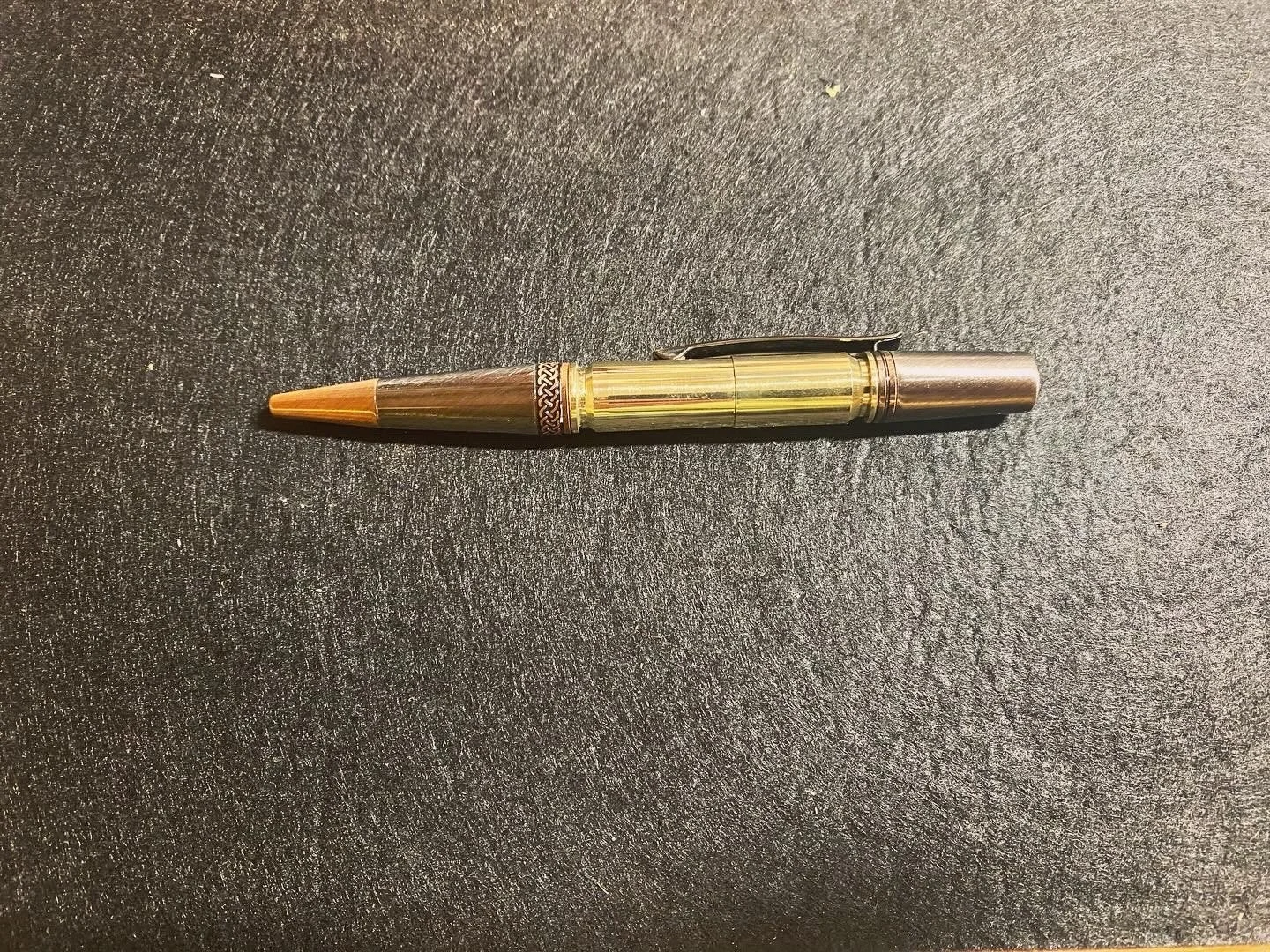 A .308 and .45 ACP once fired brass twist pen.