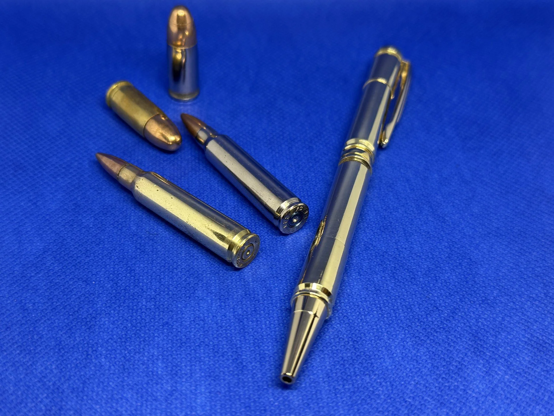 The AFO pen.
This pen is made using once fired casings from the two calibres commonly carried by Authorised Firearms Officers in the United Kingdom, 9mm and .223/5.56mm.  These two are also used by many armed forces service members within NATO.