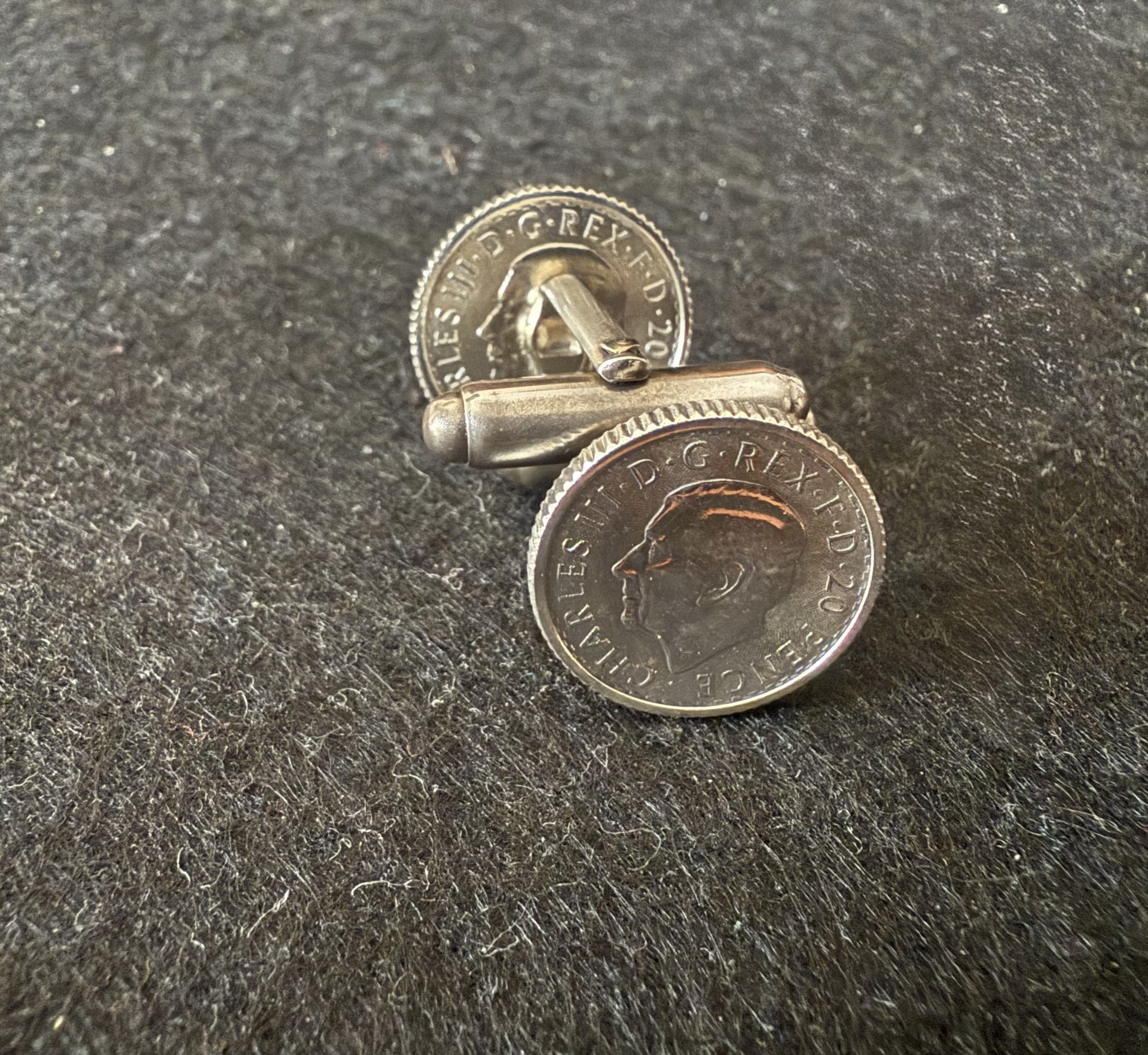 Silver Britannia cufflinks.  Made with two 1/10 oz silver Britannia coins and solid silver cufflink backs.  The backs are silver soldered directly onto the coins, no epoxy here.