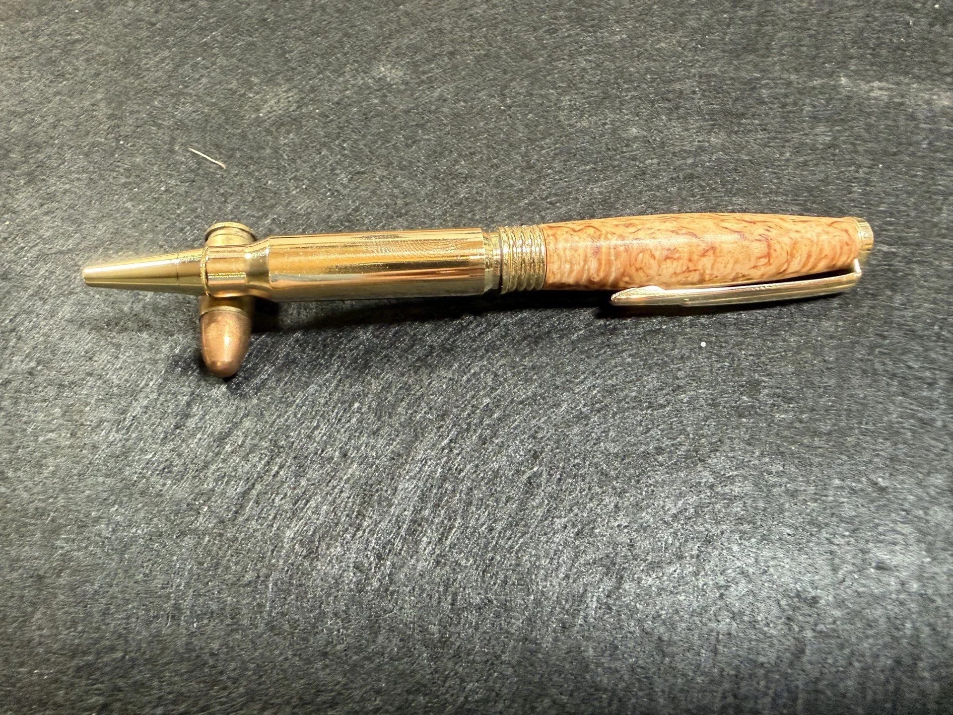 A .308 once fired casing and Masur Birch twist pen.
