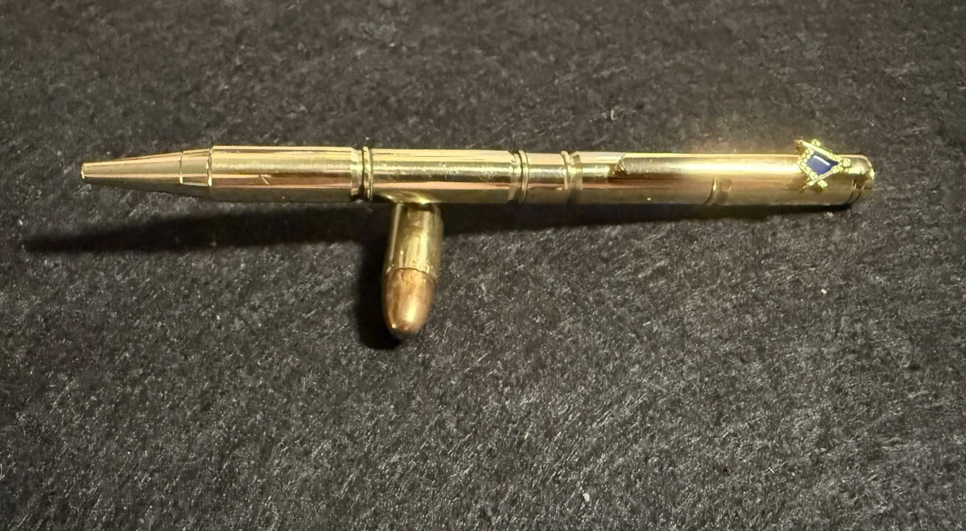 The .556 Pen.
This pen is made from 4 once fired .556 casings and is finished with a masonic pocket clip.