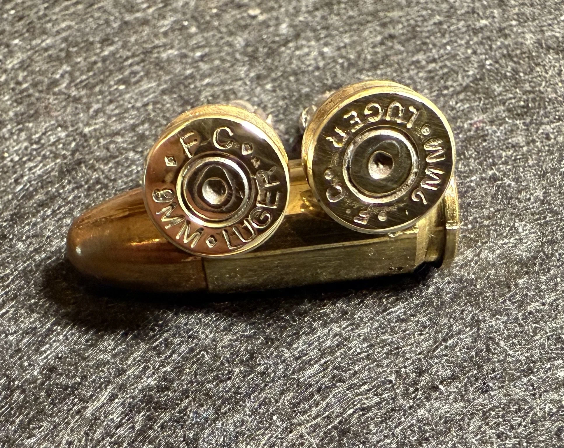 Another view of some 9mm Cufflinks, showing the struck primers of the once fired brass.