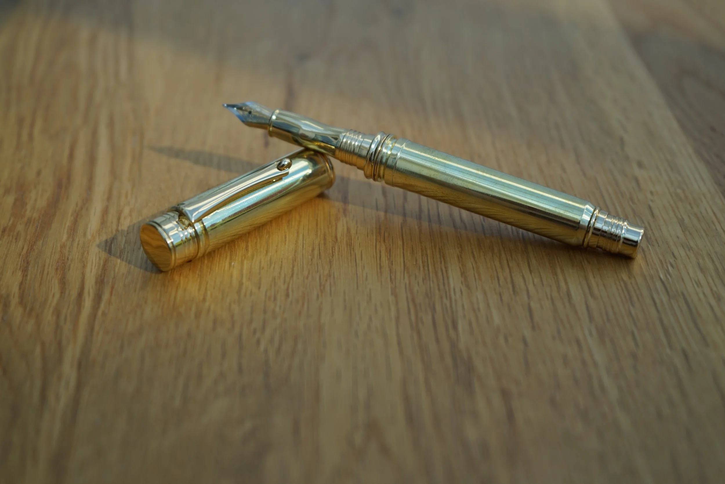 A fountain pen made with a once fired .338 Lapua and .300 MEN casing.
