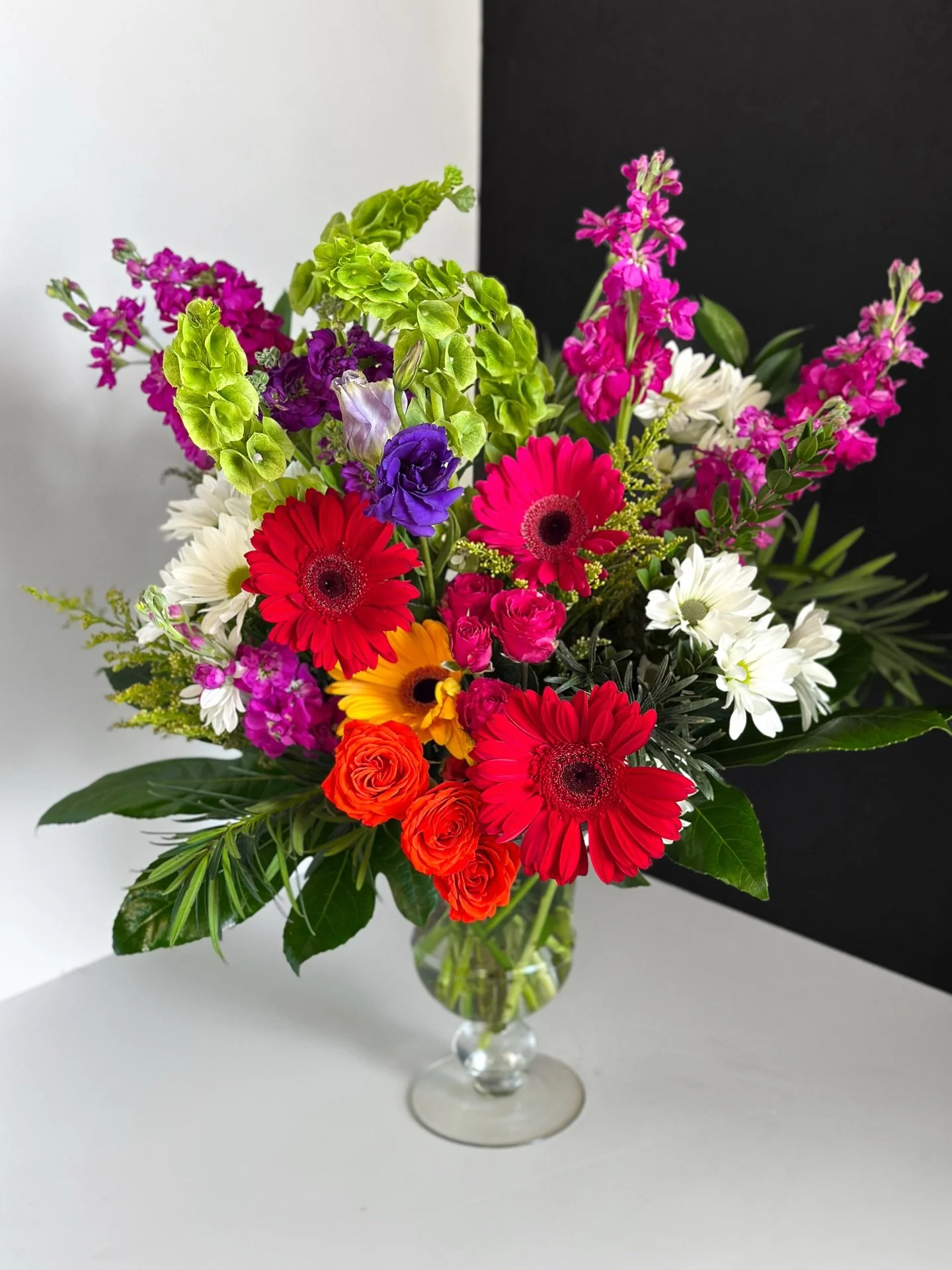 Looking for a nice arrangement for Administrative Professional Day? We have you covered! This is our new arrangement for it and it will be only available for call in orders. It features Gerbera Daisies, Roses and Seasonal Stock all in glass vase, $10