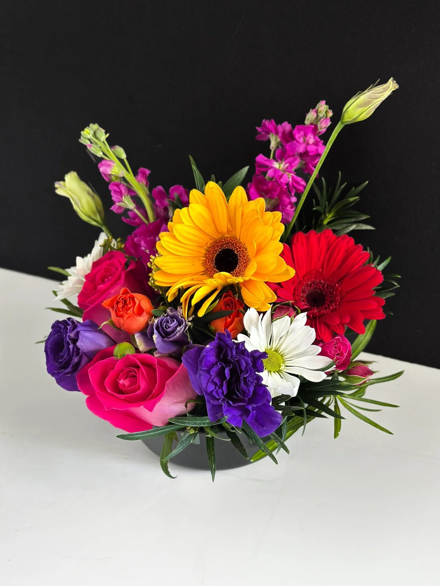 New Arrangement! This is the &ldquo;Spring Sunrise&rdquo; , featuring Gerbera Daisy&rsquo;s, Roses and seasonal stock.  This will be live on our Uber / Door store tomorrow and live for purchase in store today, $65! Call in 210-434-1134
