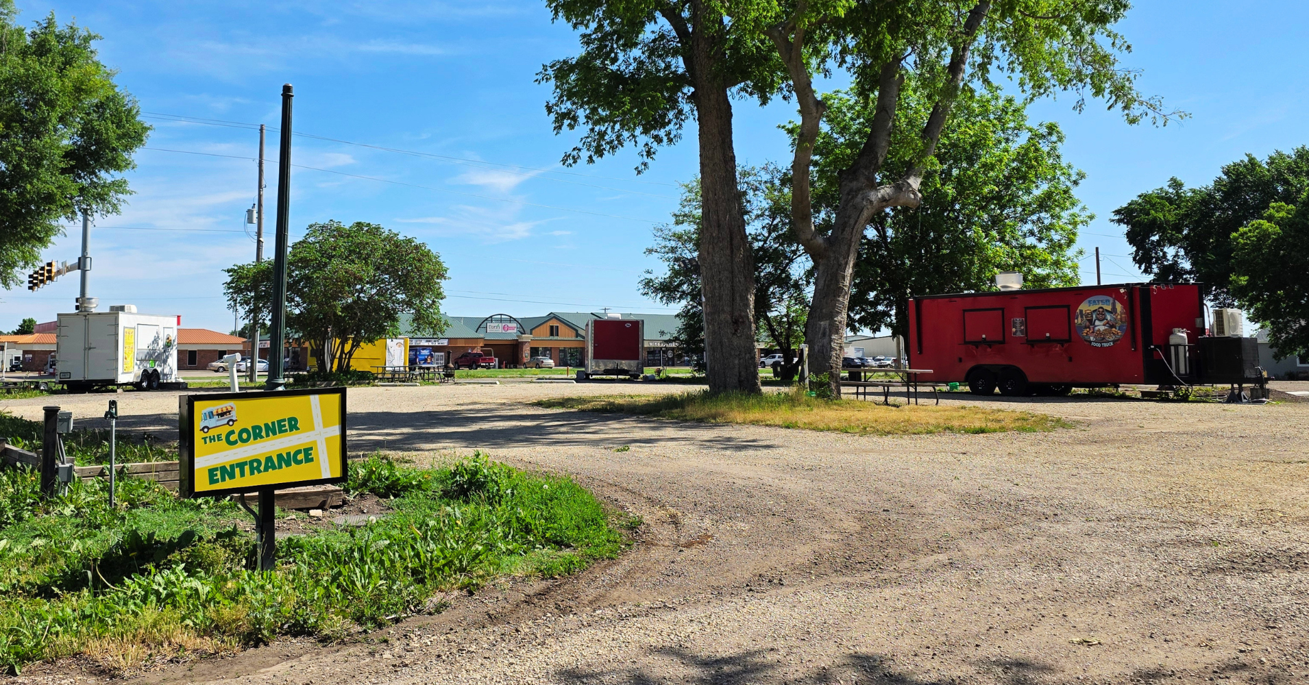 Four food trucks at a food truck court on the corner of Highway 24 and Green Valley Road in Manhattan Kansas