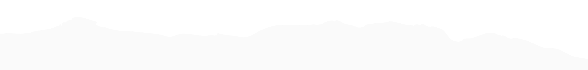 Black silhouette of a mountain range with multiple peaks and valleys against a white background.