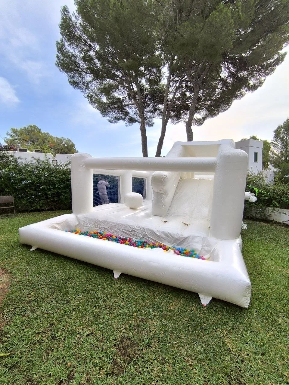 White bouncy castle with slide and ball pit hire in Sol de Mallorca