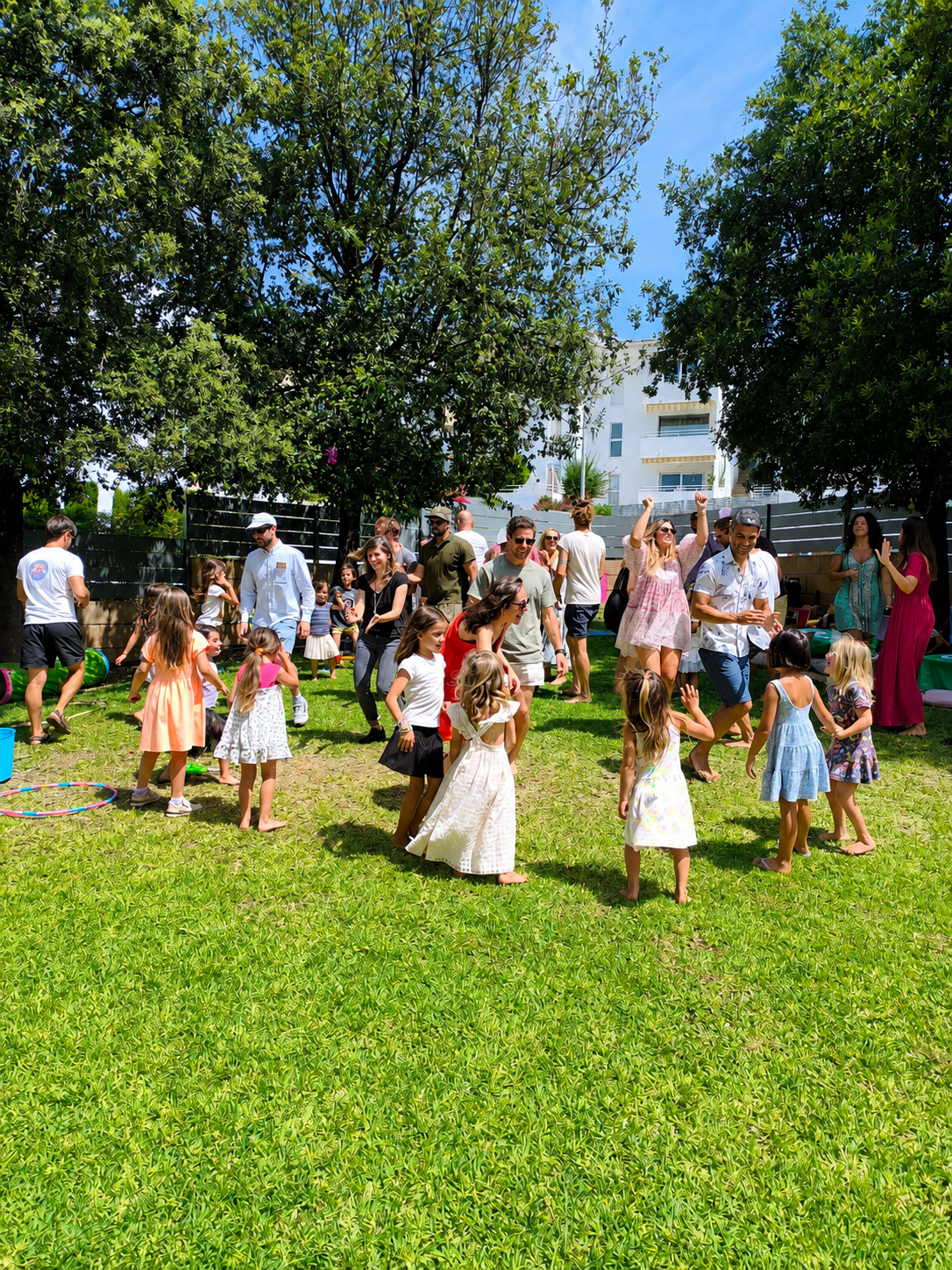 Children and parents dancing together at a Norivan event in Palma, Mallorca