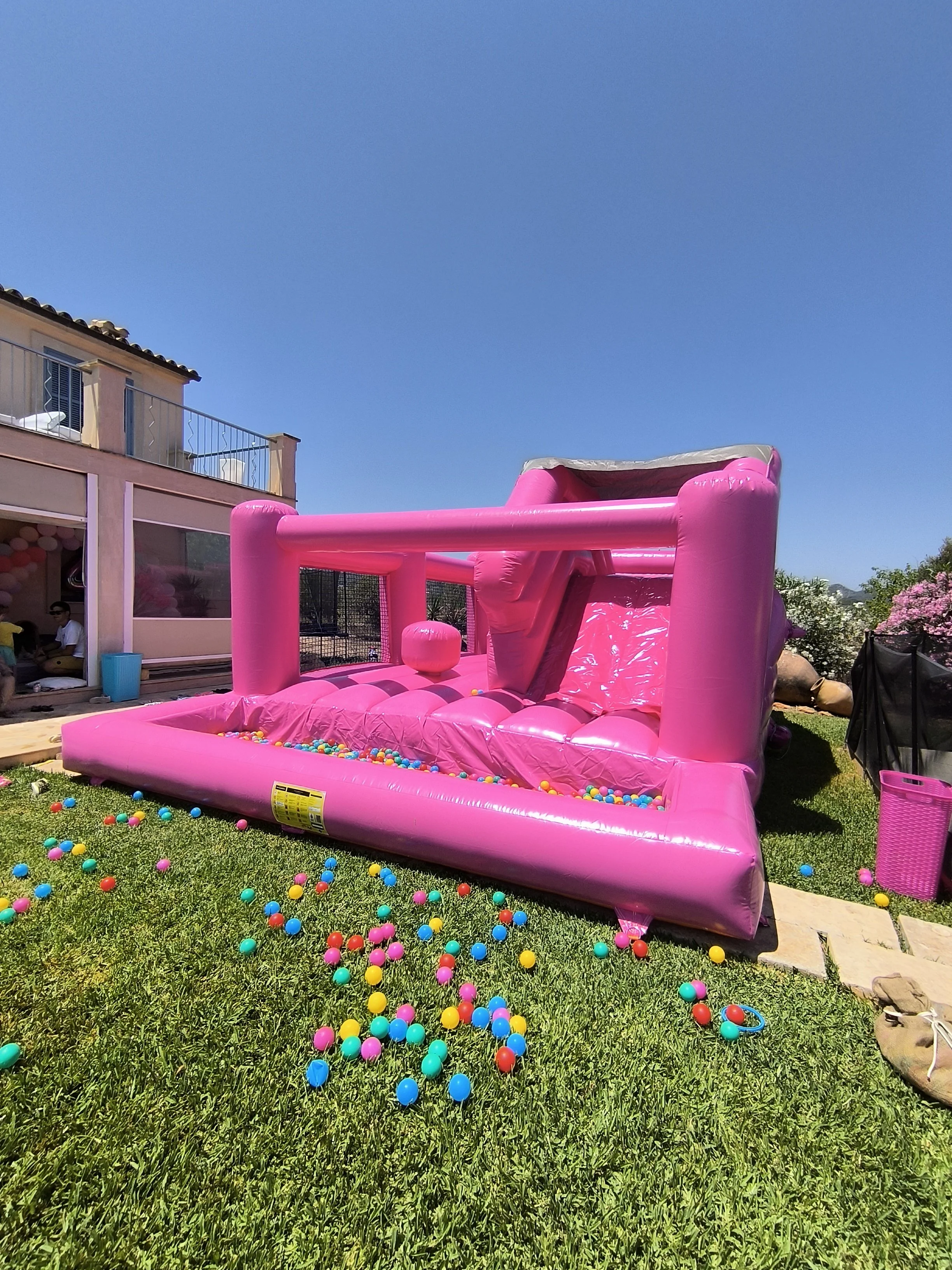 Pink luxury bouncy castle set up for a children celebration in Calvia Mallorca.