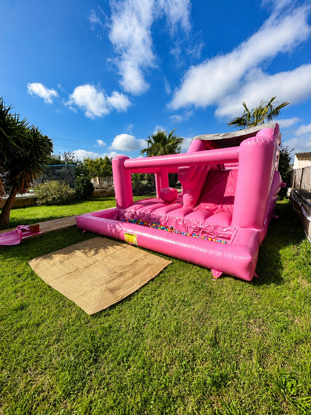 Rich pastel pink bouncy castle for a kids’ party at a finca in Mallorca