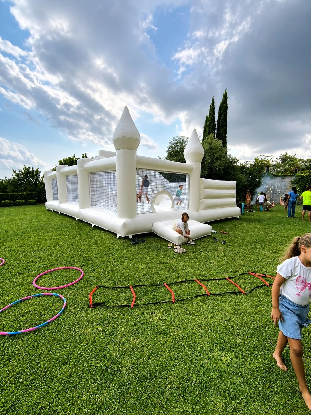 Norivan large white bouncy castle with children playing in Santa Maria, Mallorca
