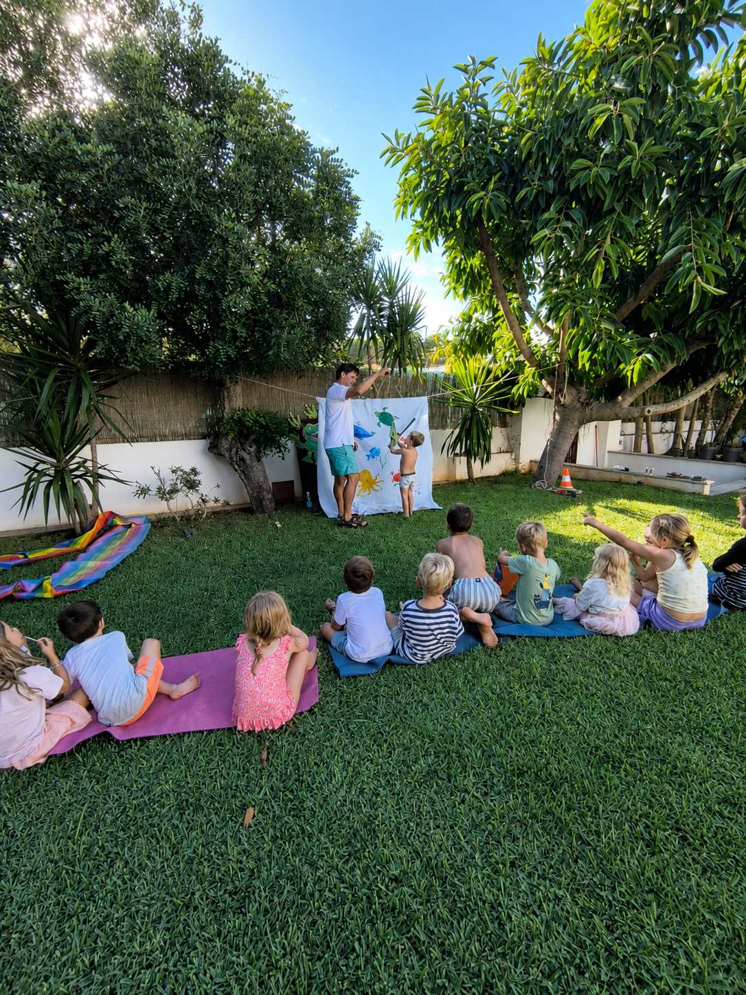 Children enjoying a fishing game with goodie bags at a party in Palmanova, Mallorca
