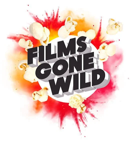A graphic of the text 'Films Gone Wild' in bold three-dimensional letters with a popcorn theme, featuring scattered popcorn pieces against a colorful splash background of red, orange, and pink.